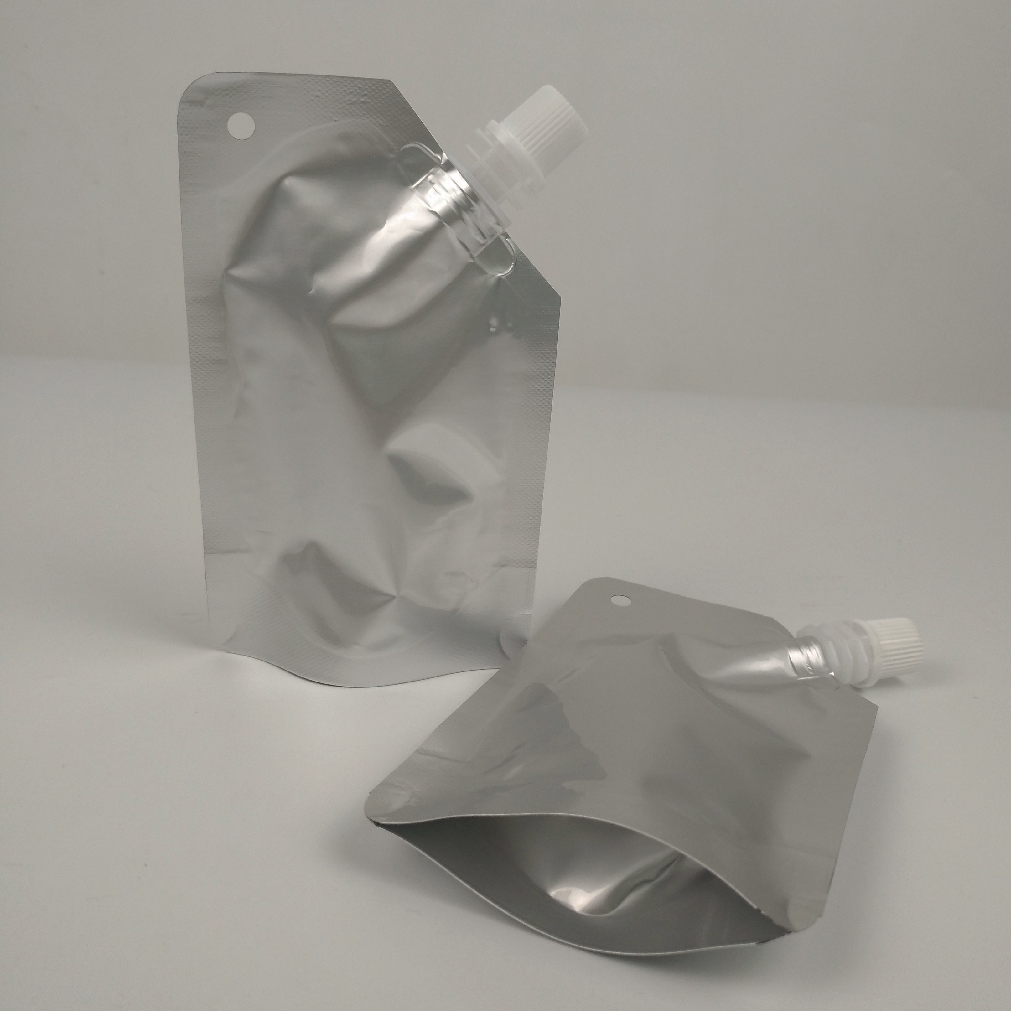 Duidelijke Zilveren Aluminiumfolie Juice Beverage Spout Pouch Packaging 100ml 150ml